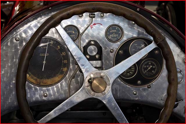  in the shape of the dash and wheel on a classic Bugatti